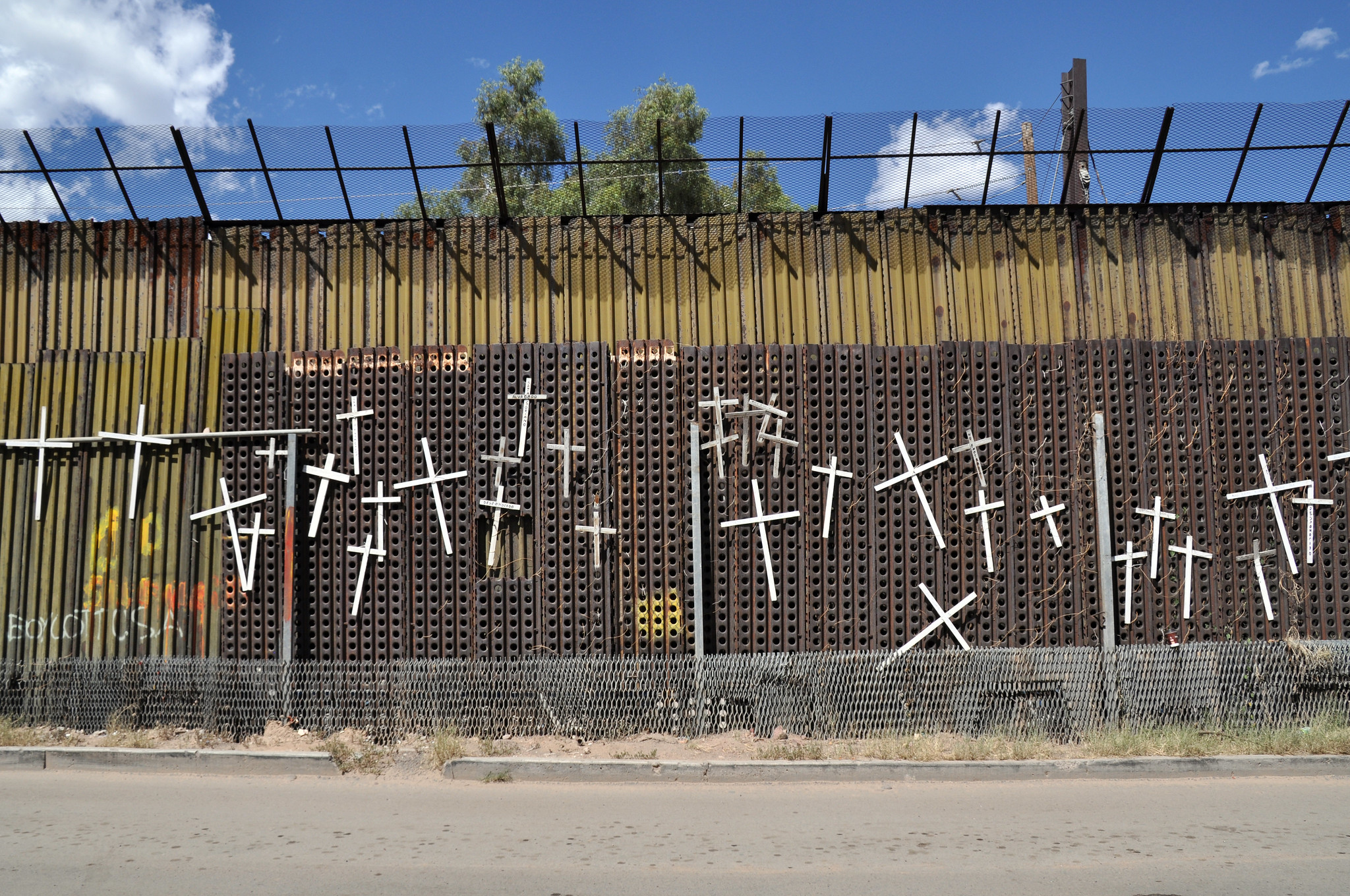 White crosses with the names of those who have died crossing the US border adorn the Mexican side of the wall in Heroica Nogales, Mexico.