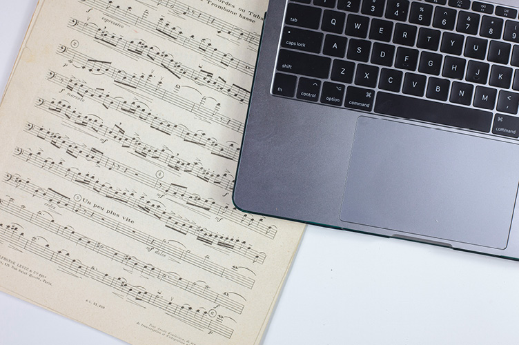 Sheet music and a laptop