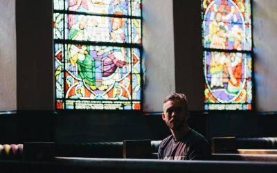Person sitting in pew