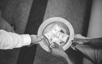 Overhead shot of the offering plate being passed