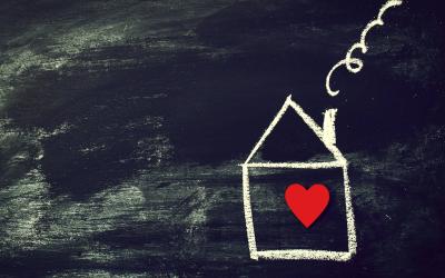 line drawing of a house with a red heart