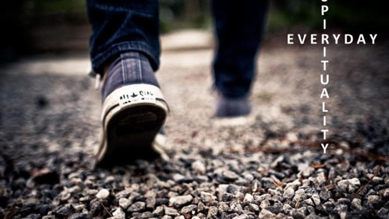 Feet walking on gravel path with text "everyday spirituality"