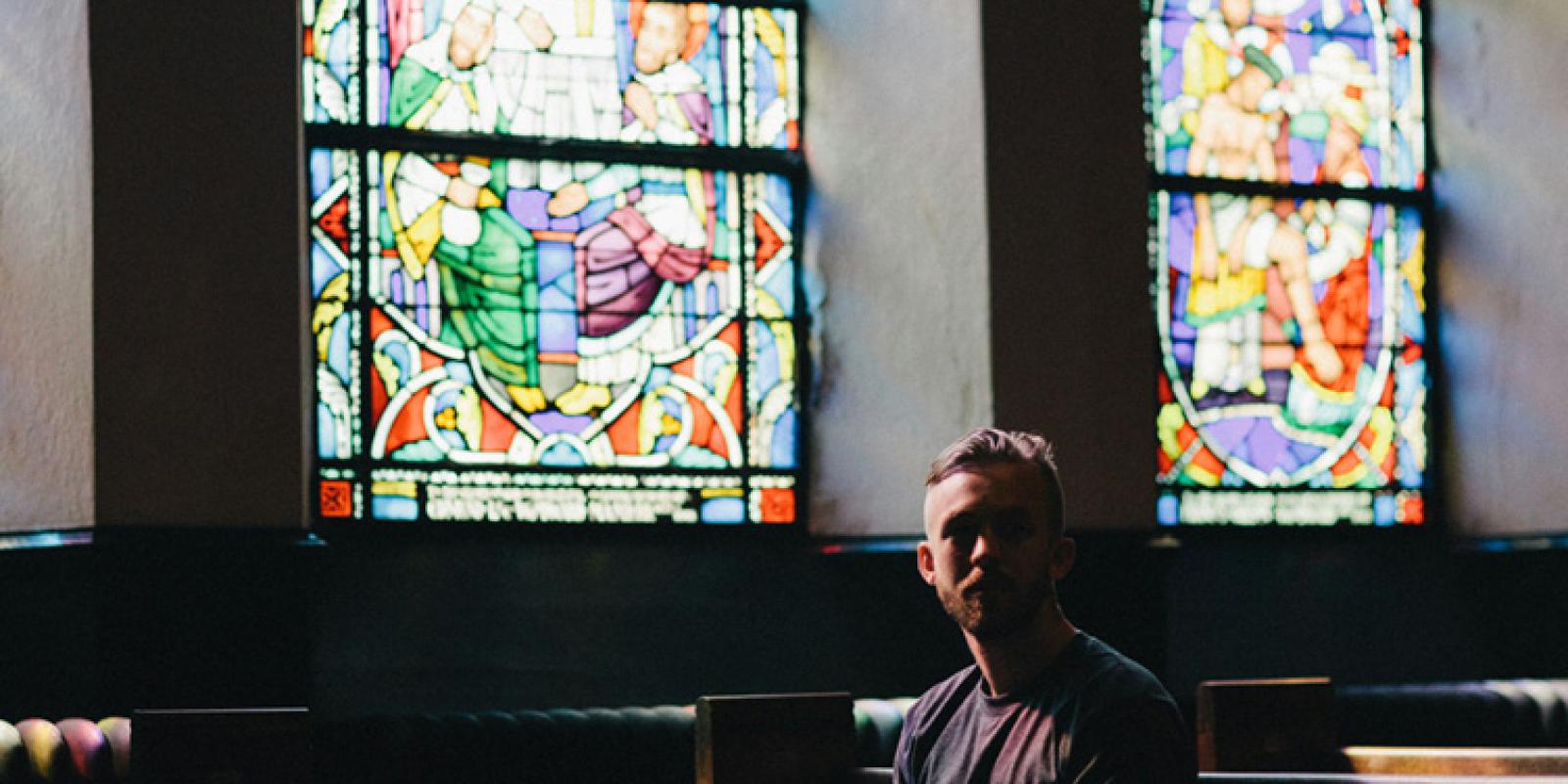 Person sitting in pew