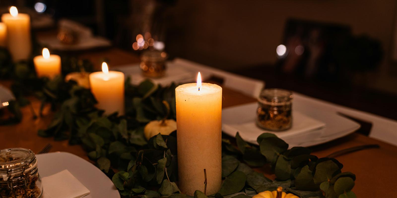 Thanksgiving setup with candles and pumpkins