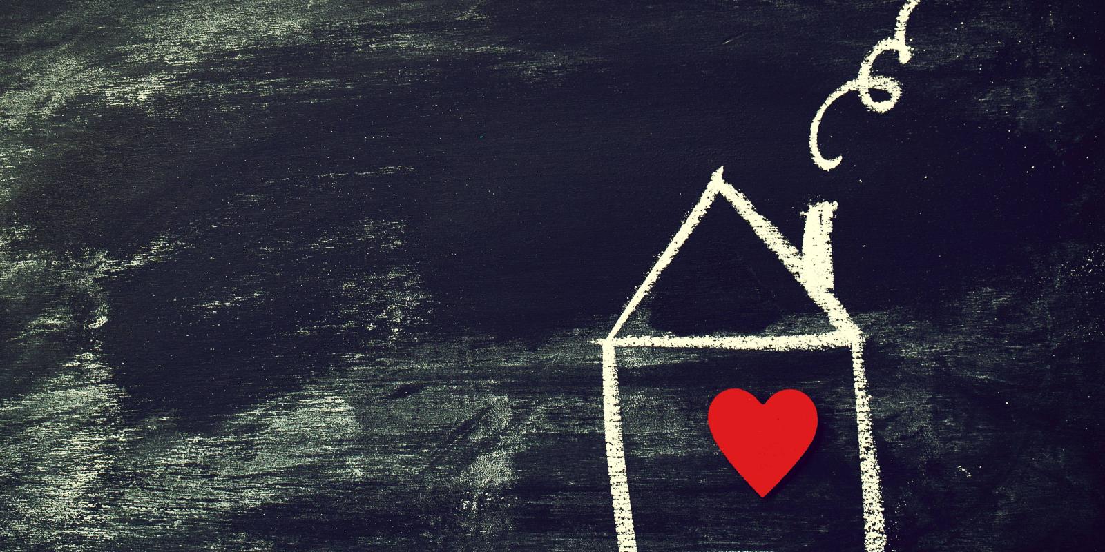 line drawing of a house with a red heart