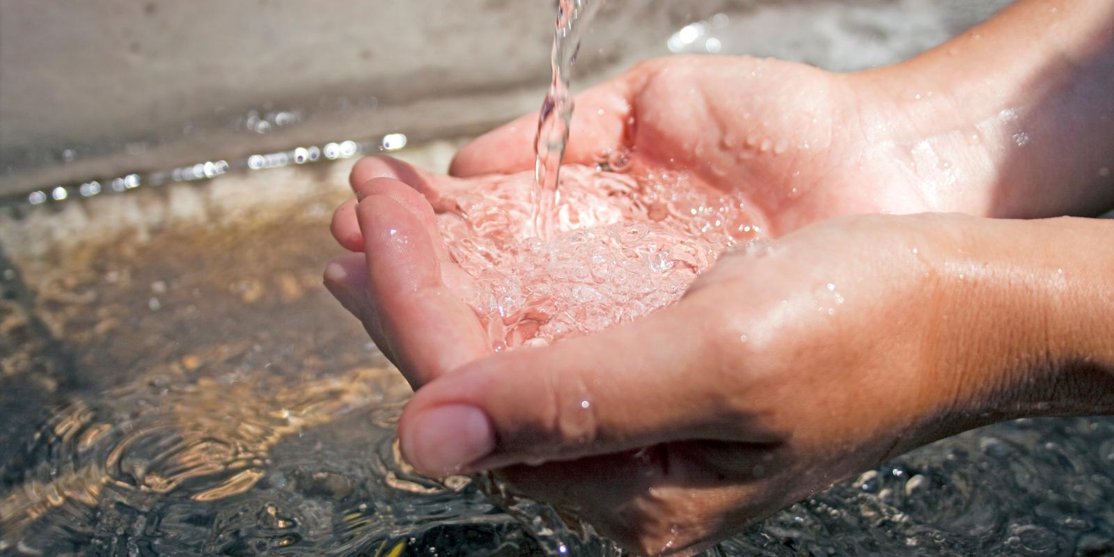 Hands in water
